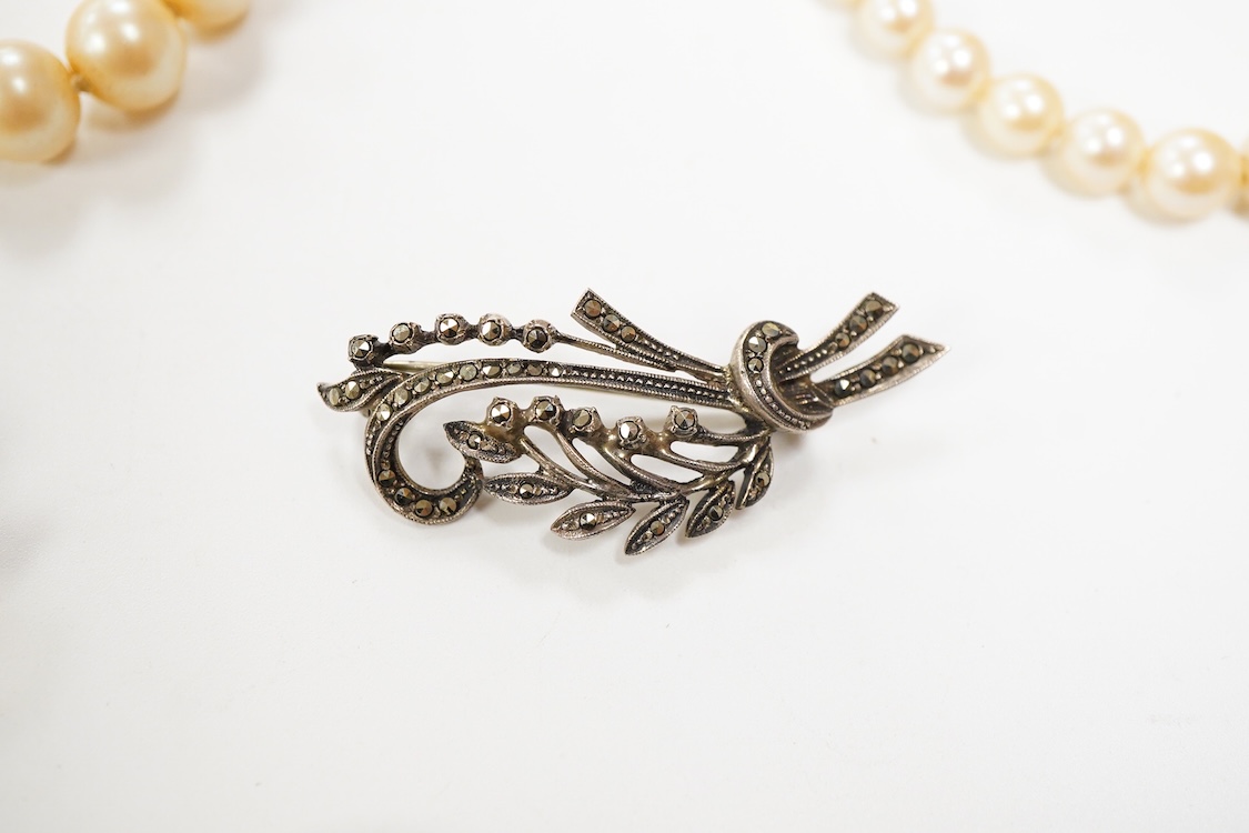 Two single strand graduated cultured pearl necklaces, one with a single stone rose cut diamond set 9ct white metal clasp, 42cm, together with a simulated pearl necklace and three assorted costume brooches.